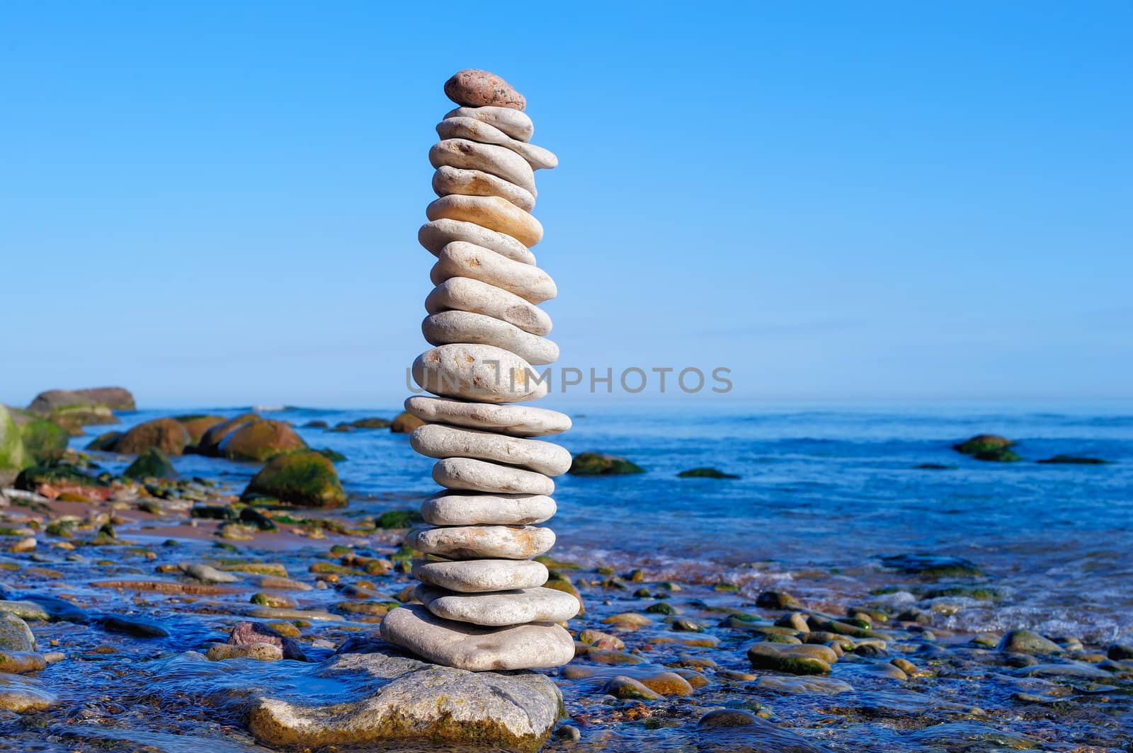 Stack of the white pebble on the seashore