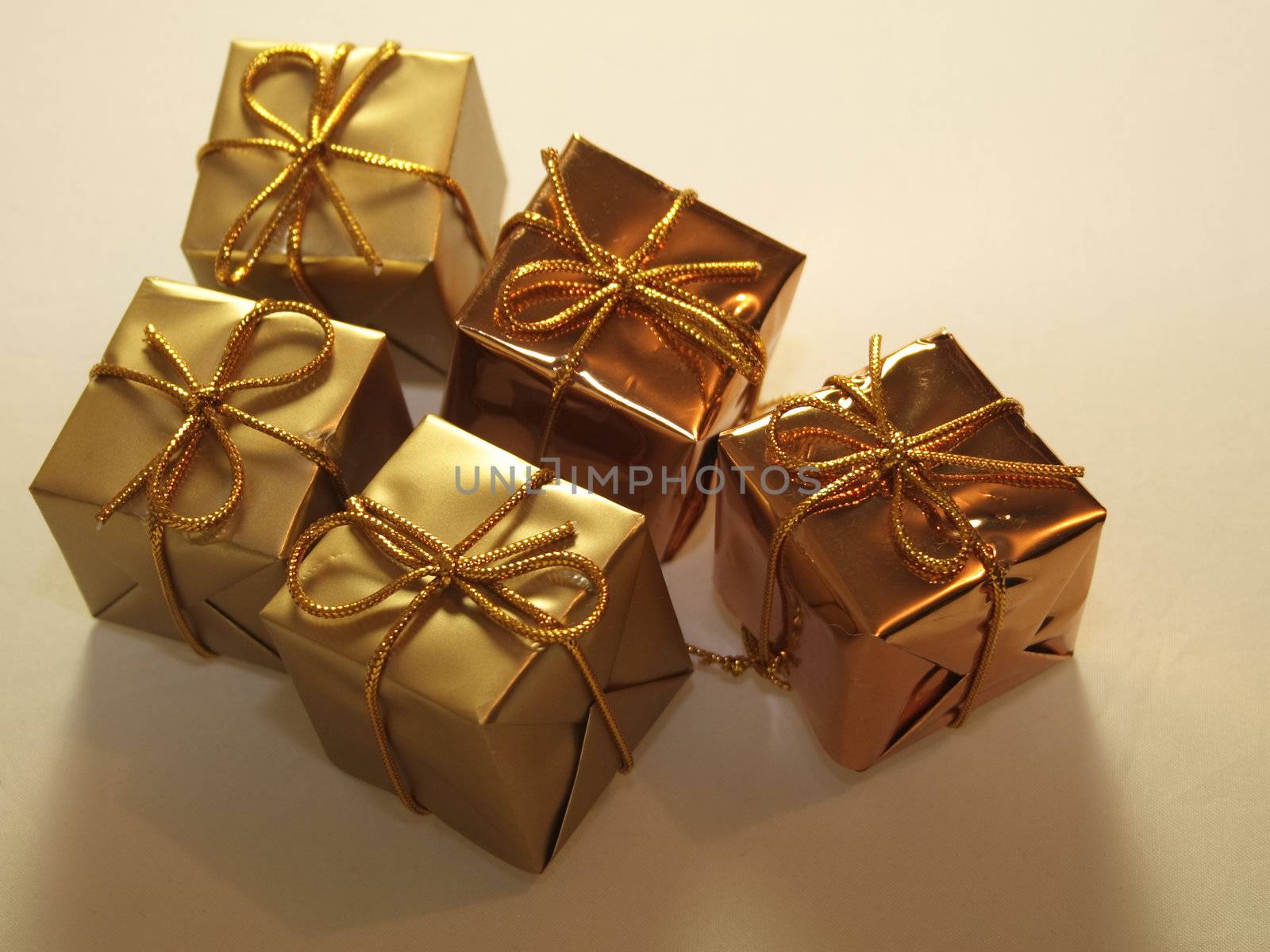 gold present decorations by leafy