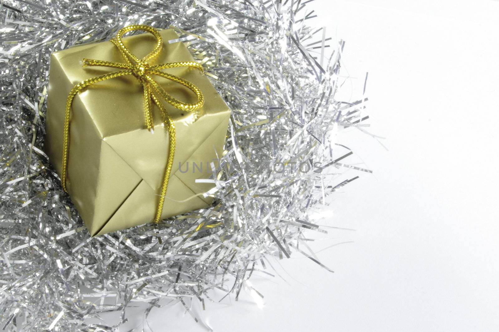 gold present and silver tinsel by leafy