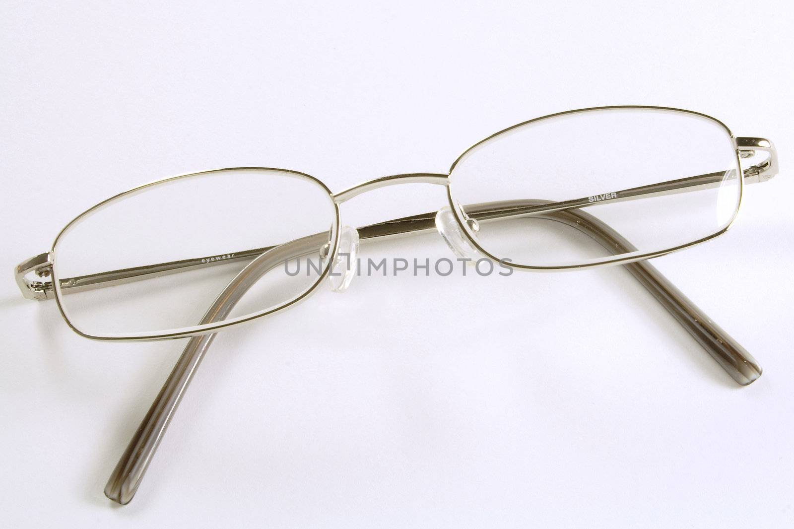 a plain silver rimmed pair of spectacles