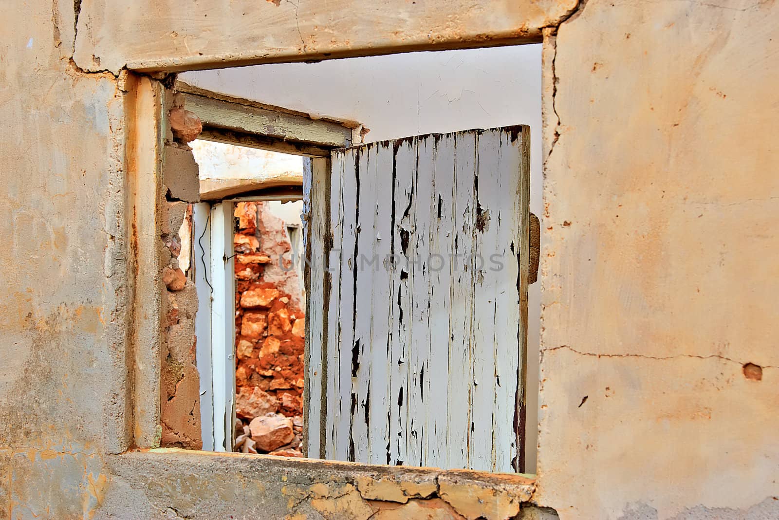 look through the window and the door in the ruins