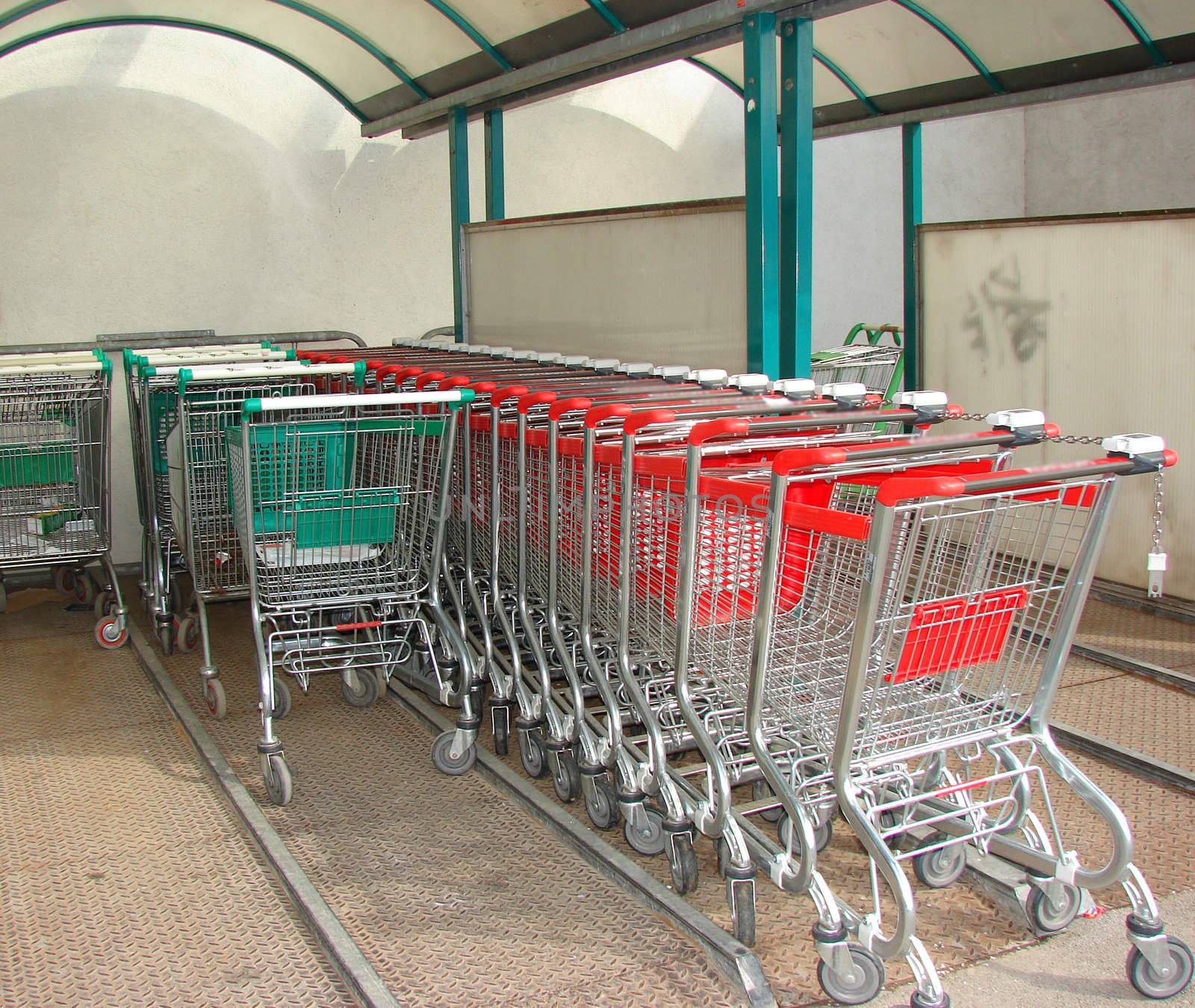Supermarket trolleys in the rows.