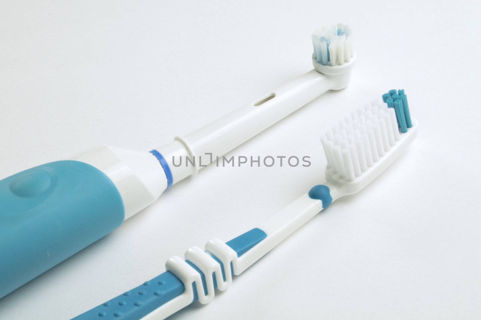 electric tooth brush challenges the normal toothbrush