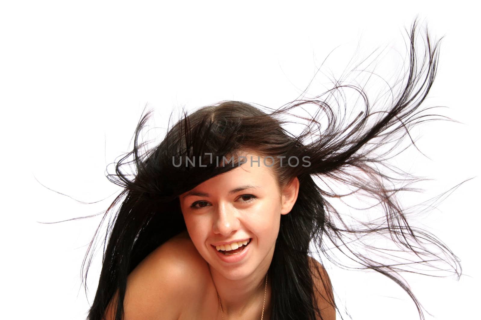 brunette girl with long windy hair, isolated on white