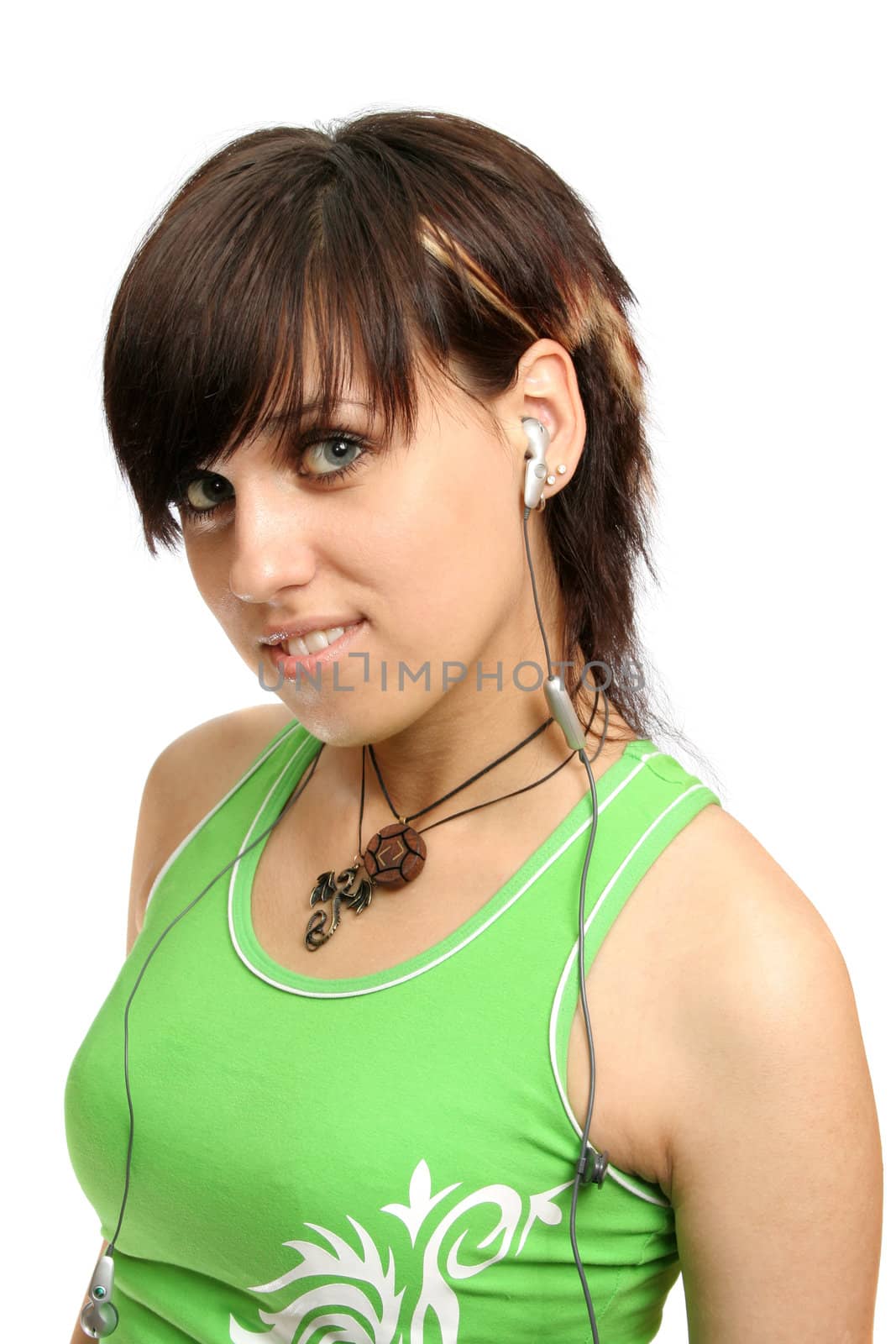 A smiling young girl with mobile's headphones, isolated on white