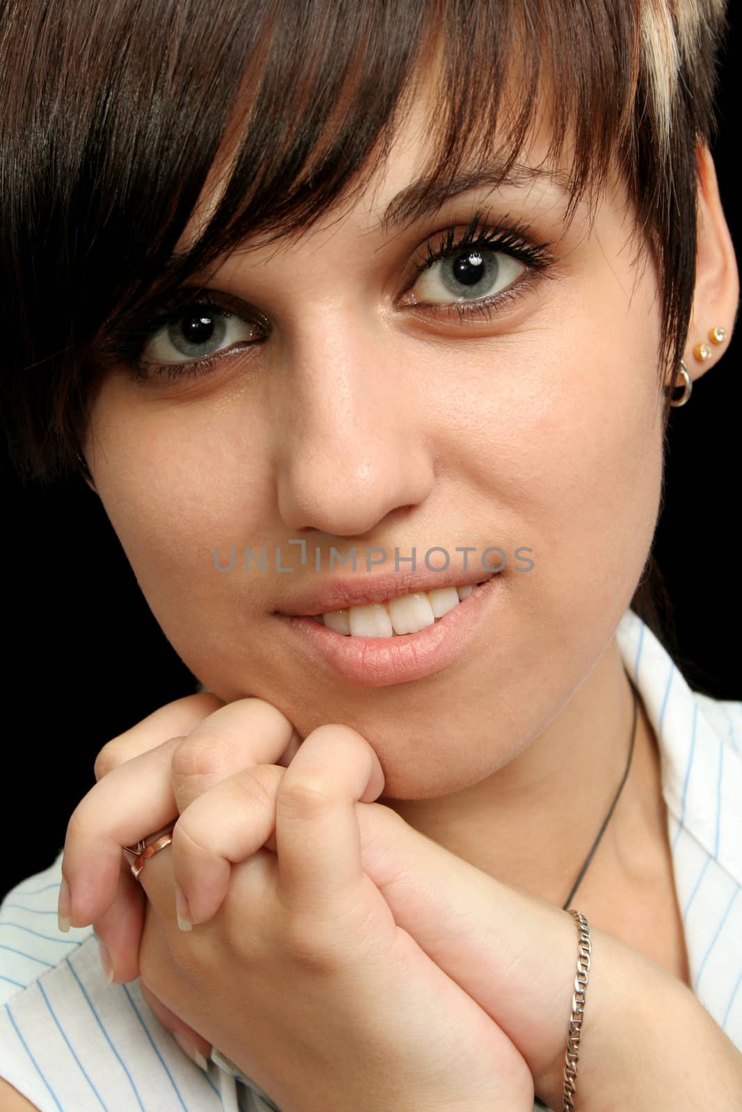 The young girl with expressive emotions, isolated on black background