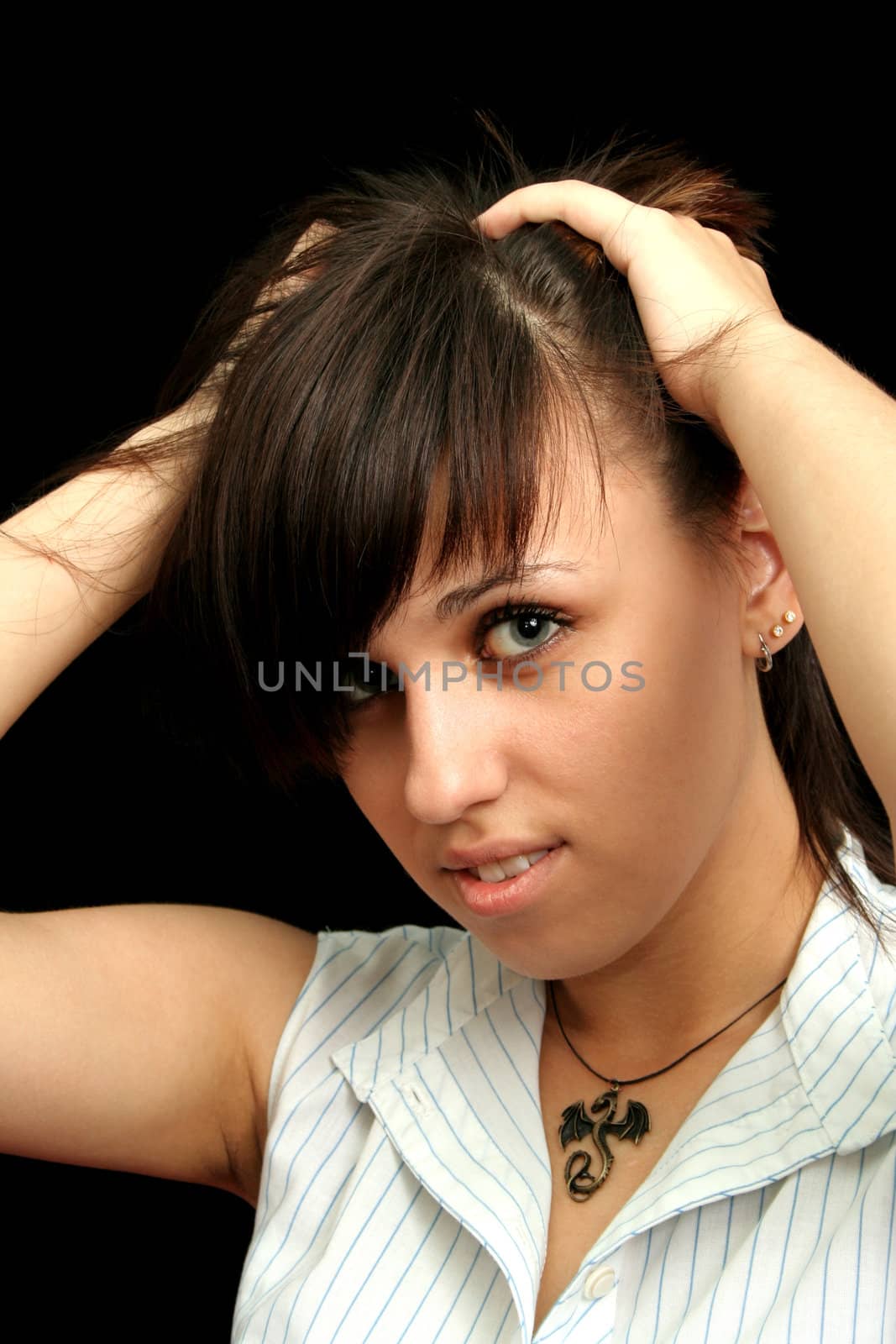 The young girl with expressive emotions, isolated on black background