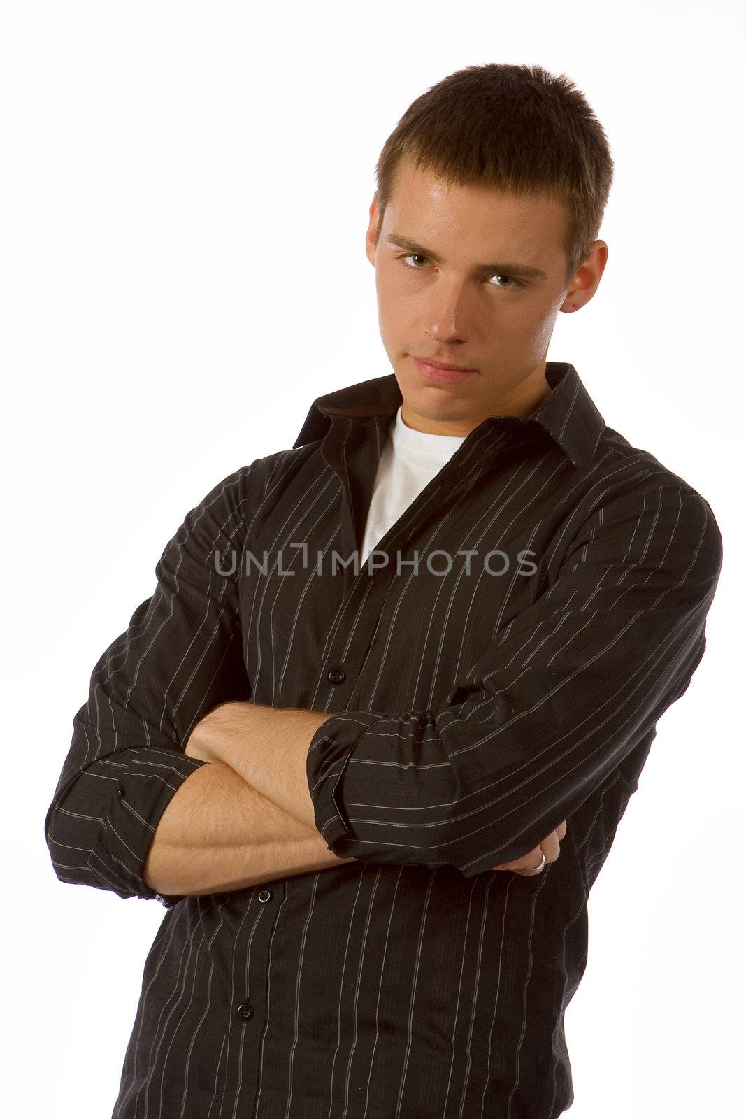 The beautiful young man posing in studio