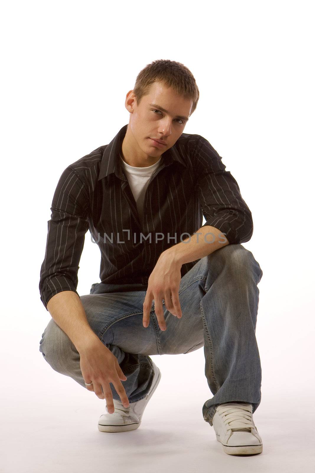The young man posing in studio by MIL