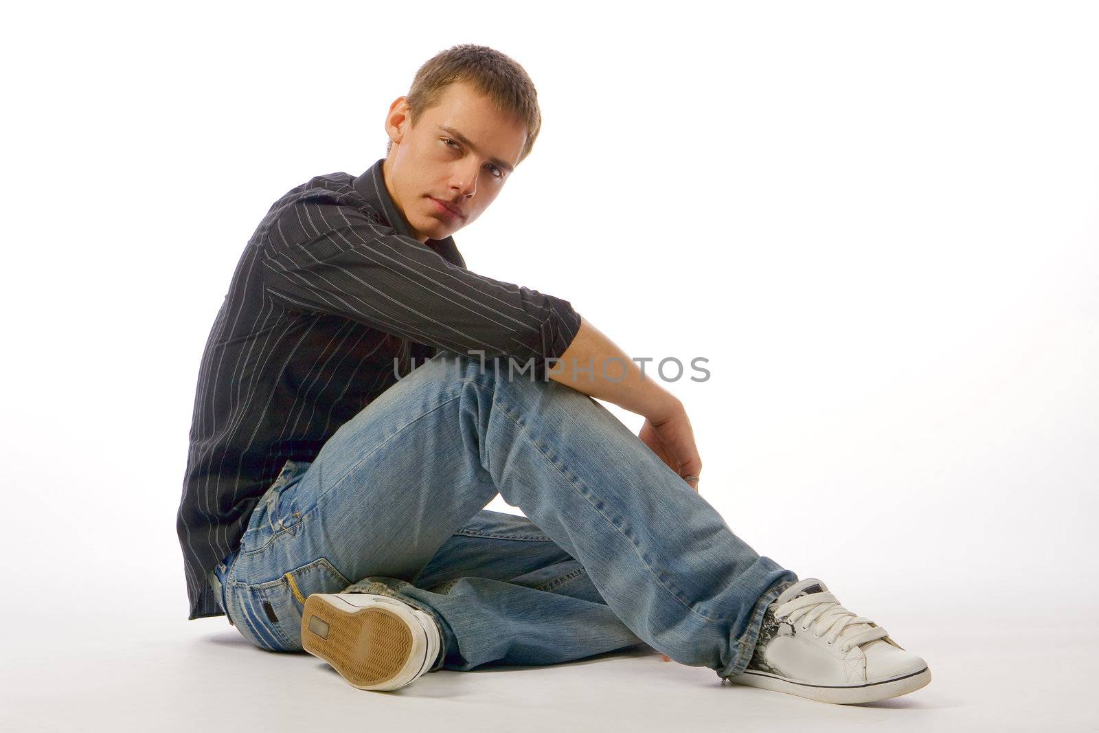 The young man posing in studio by MIL