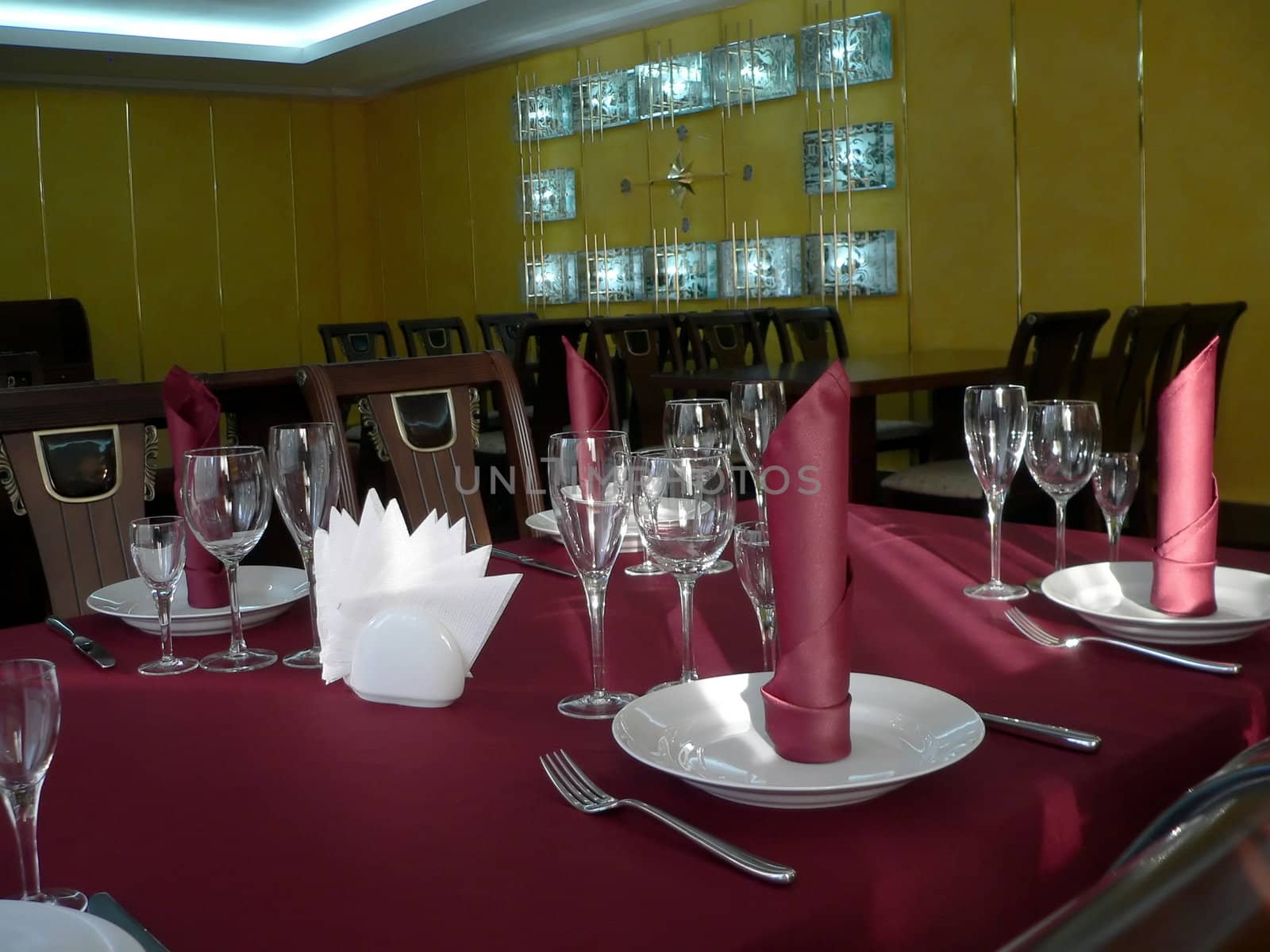 The table appointments. Table with crimson tablecloth
