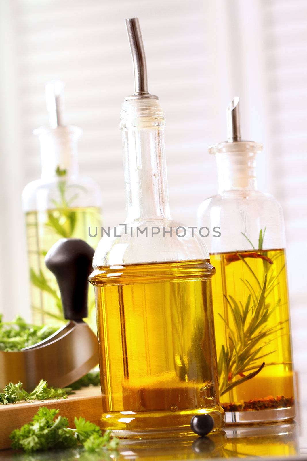 Assortment of olive oils on stainless steel counter top