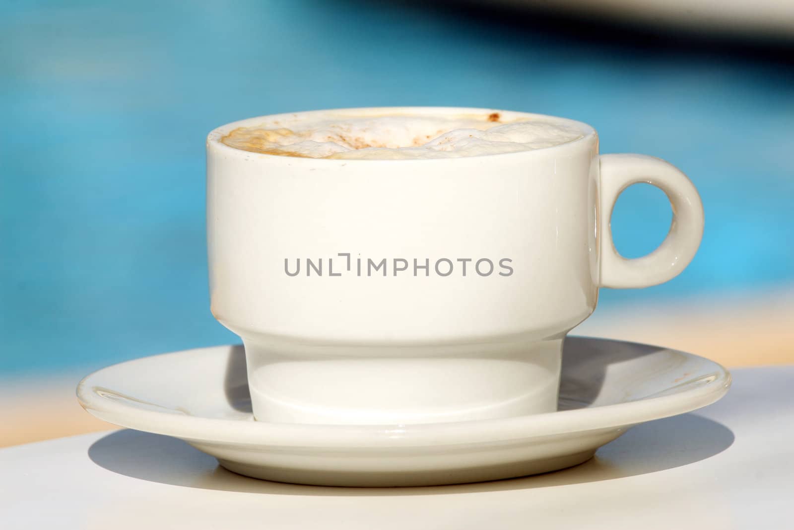 Cappuchino cup by the pool