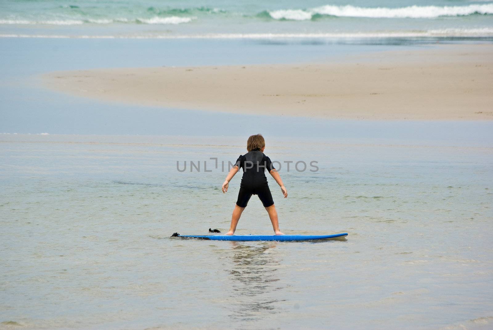 future champion got to start somewhere young boy learns to surf