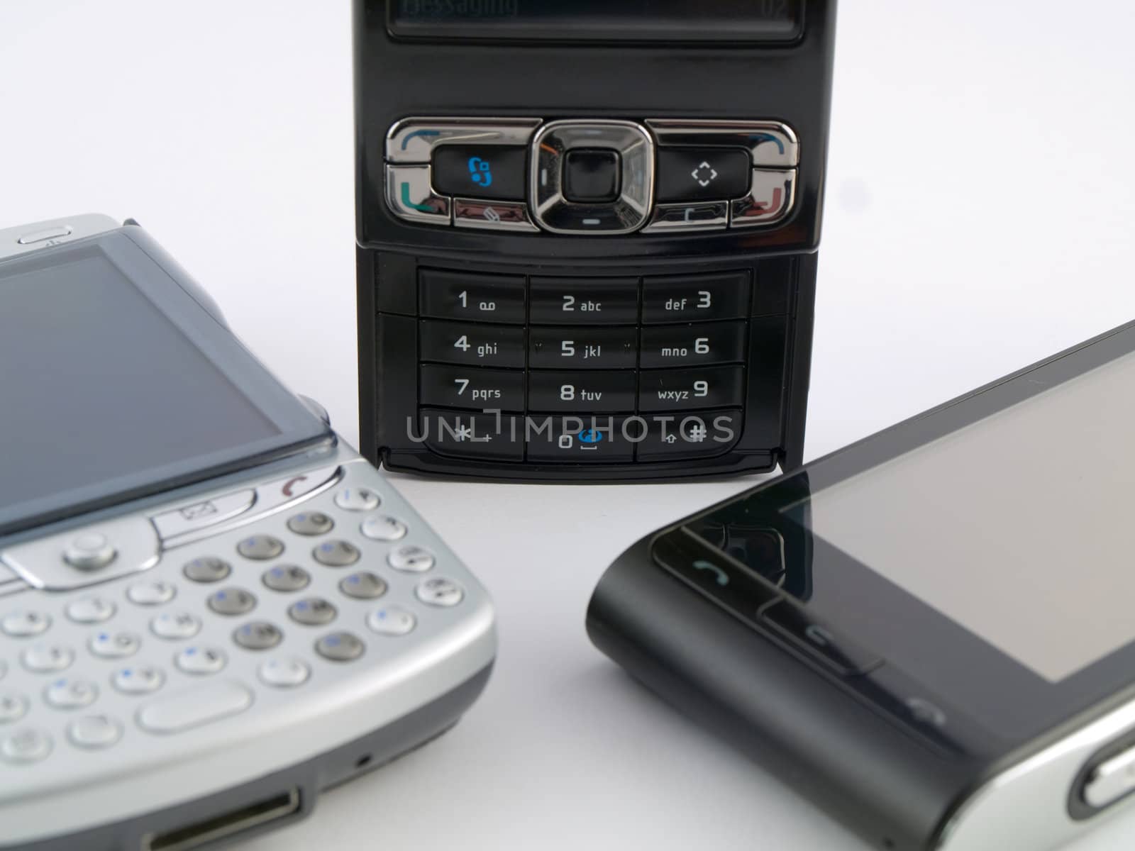 Stack Pile of Several Modern Mobile Phones PDA Cell Handheld Units Isolated on White Background