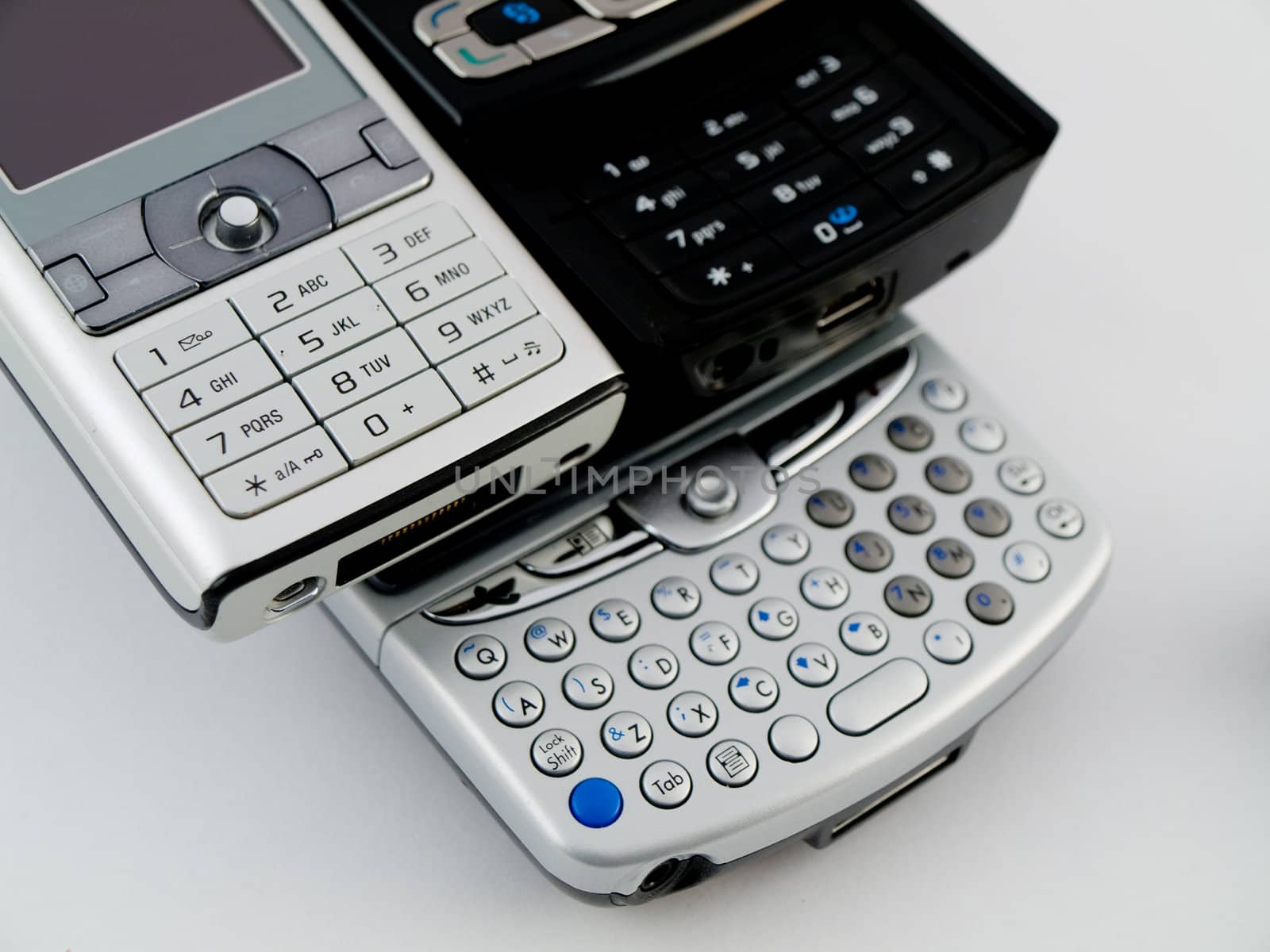 Stack Pile of Several Modern Mobile Phones PDA Cell Handheld Uni by bobbigmac