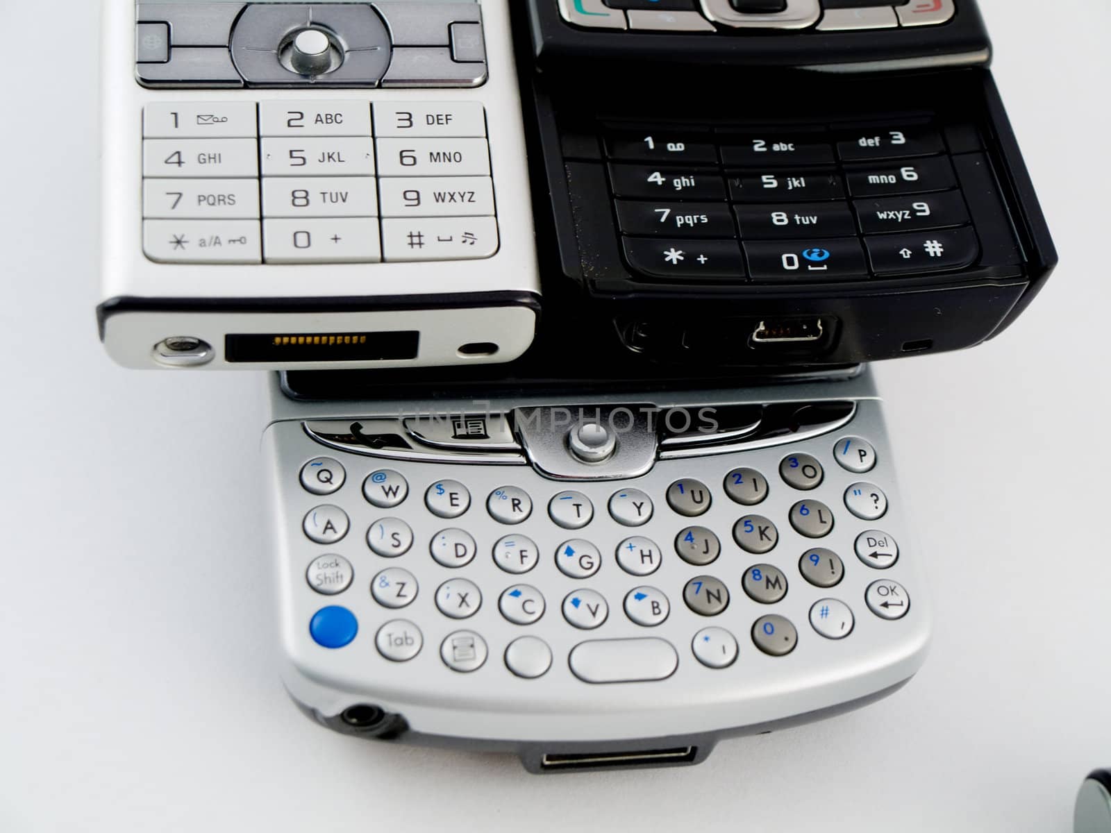 Stack Pile of Several Modern Mobile Phones PDA Cell Handheld Uni by bobbigmac