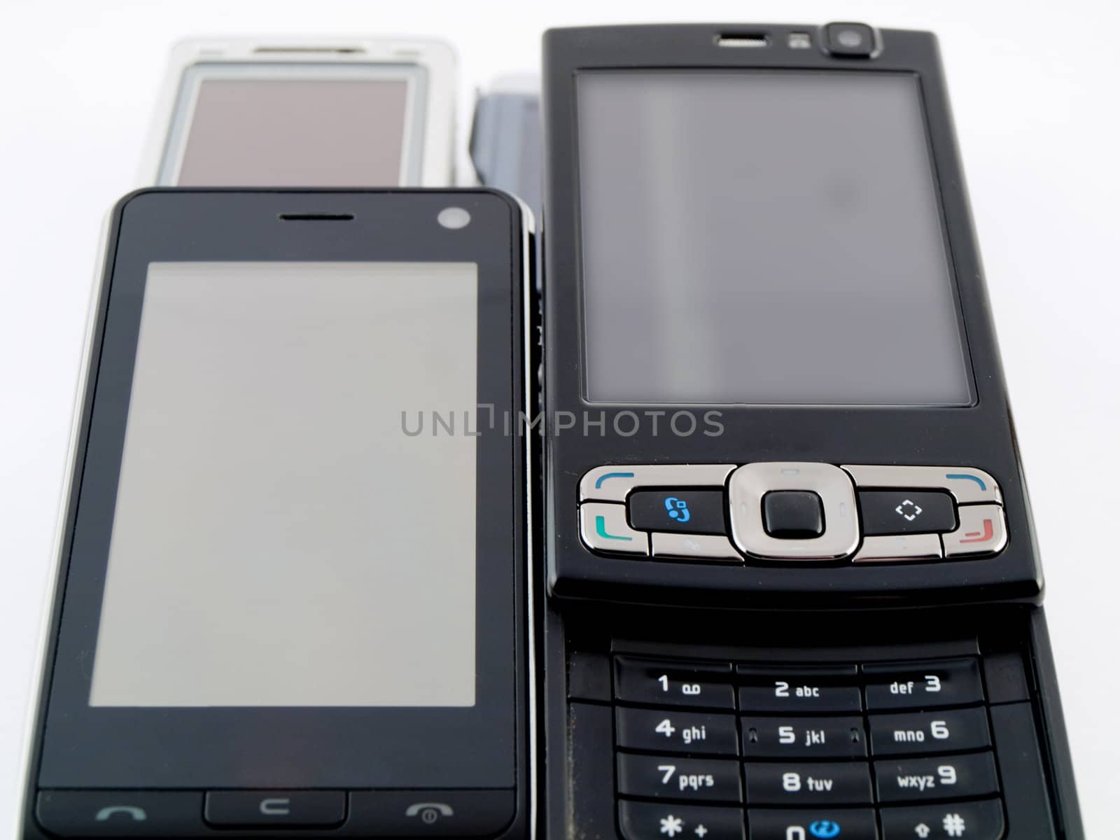 Stack Pile of Several Modern Mobile Phones PDA Cell Handheld Uni by bobbigmac