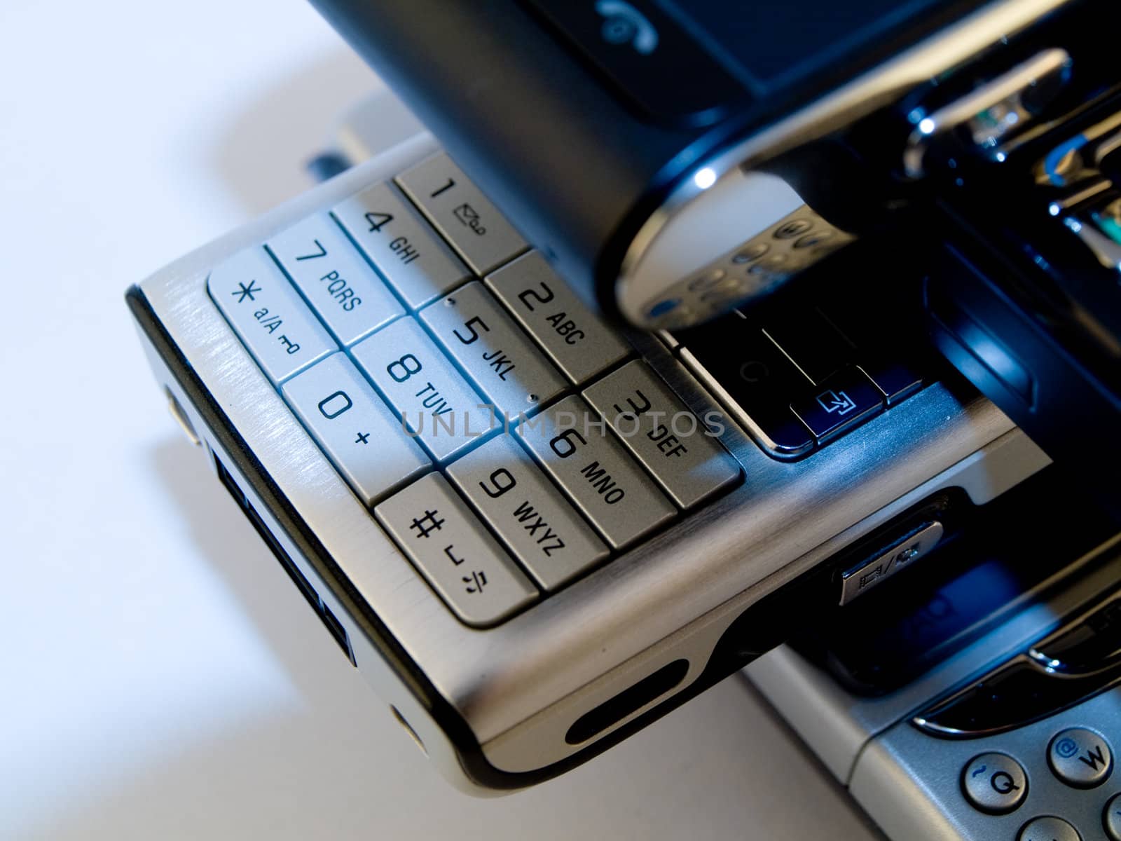 Stack Pile of Several Modern Mobile Phones PDA Cell Handheld Units Isolated on White Background