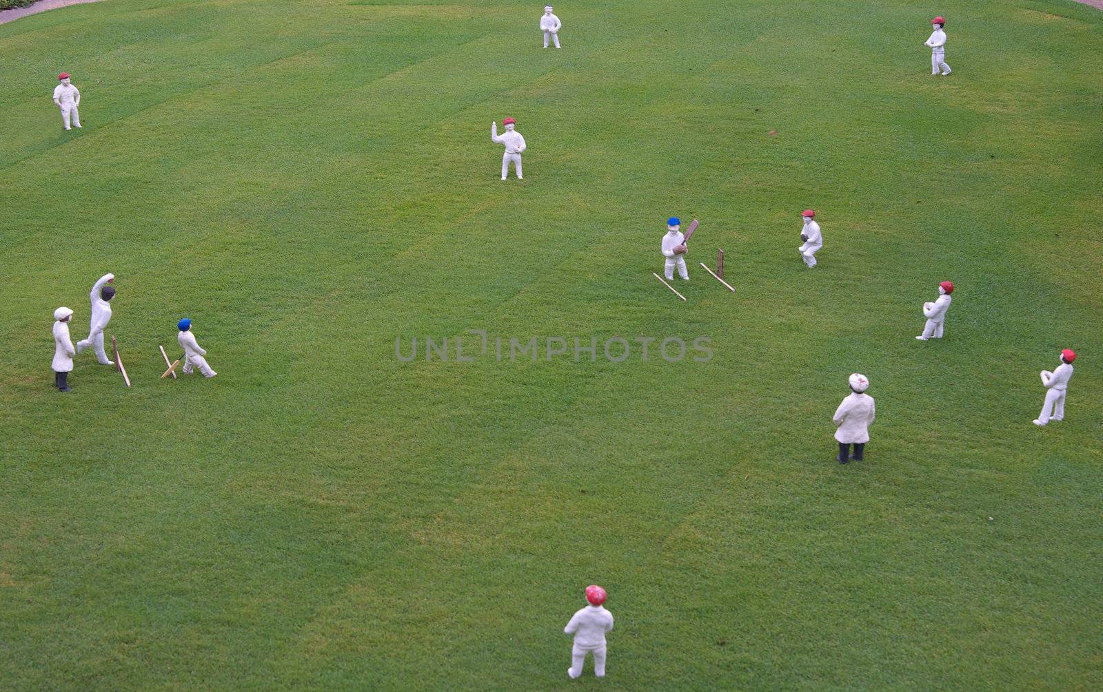 scale model of people playing a cricket match 