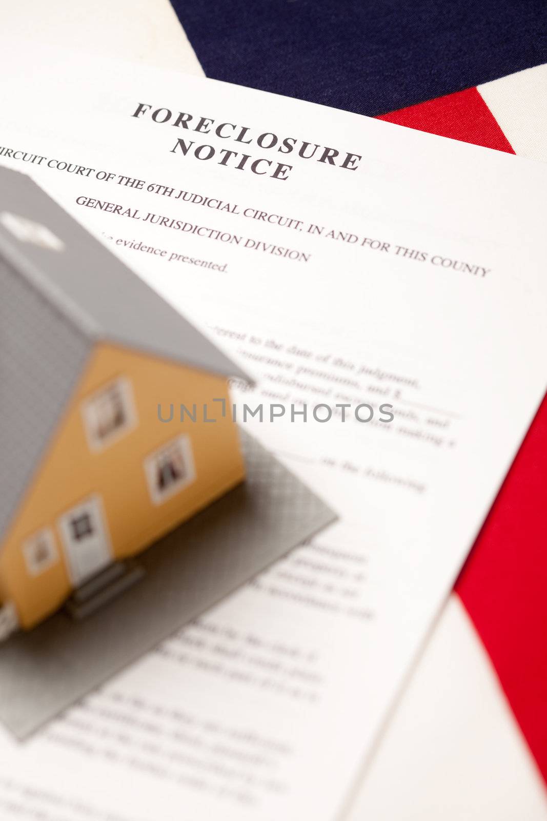 Foreclosure Notice and House on the American Flag with Selective Focus.