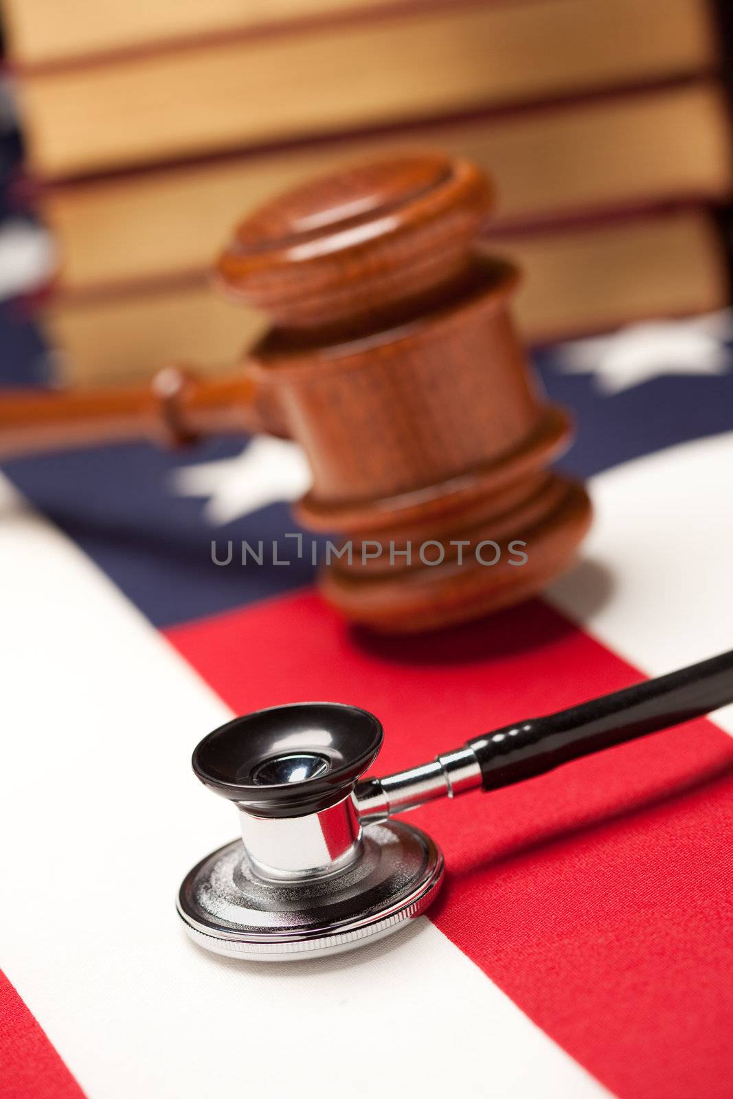 Gavel, Stethoscope and Books on Flag by Feverpitched