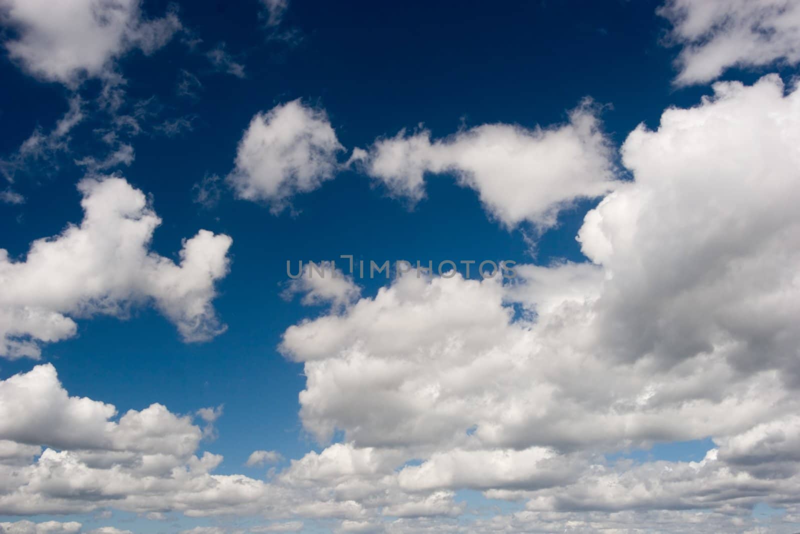 Big white clouds on blue sky.