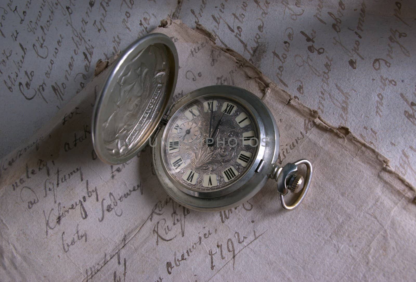 Old-time watch,current of time,handwritten documents,history