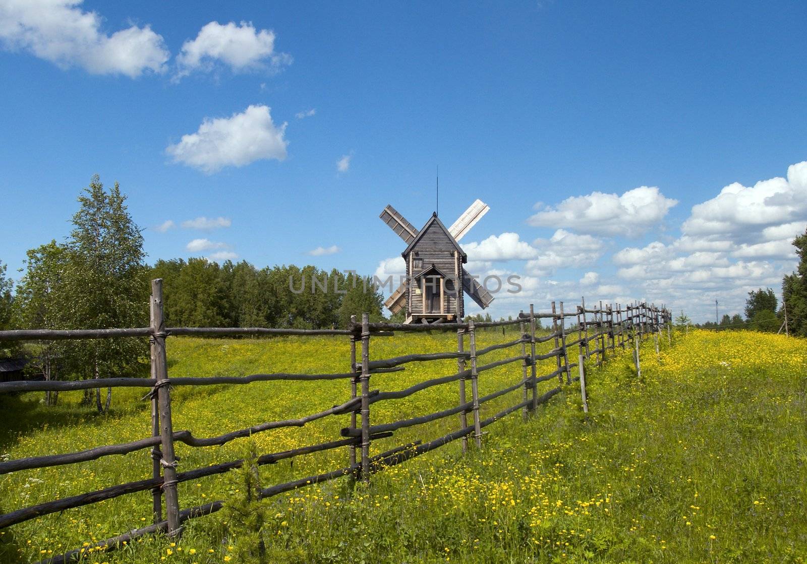 The Traditional russian rustic landscape.
Aging wooden wind mill