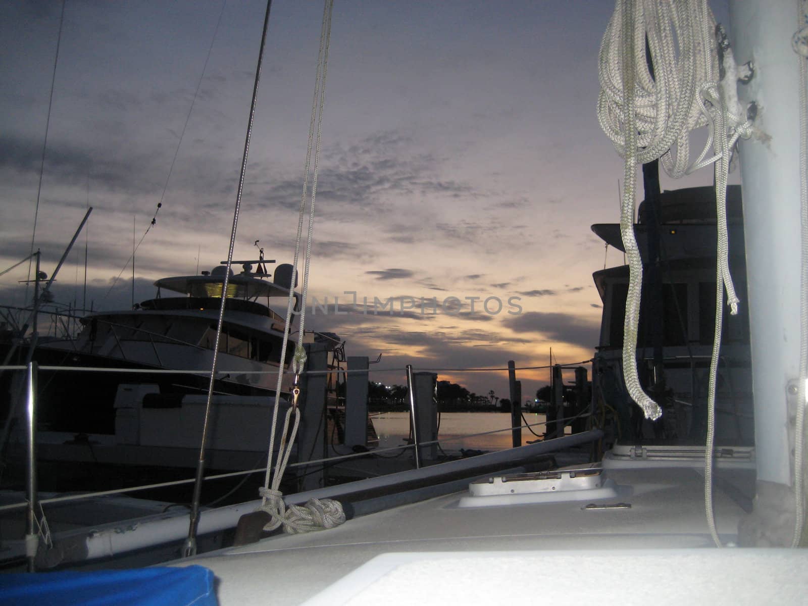 Nautical Sunrise Surprise captured in St. Petersburg Florida. Rigging, Rope and Rails frame this scenic view of sunlight and clouds.
