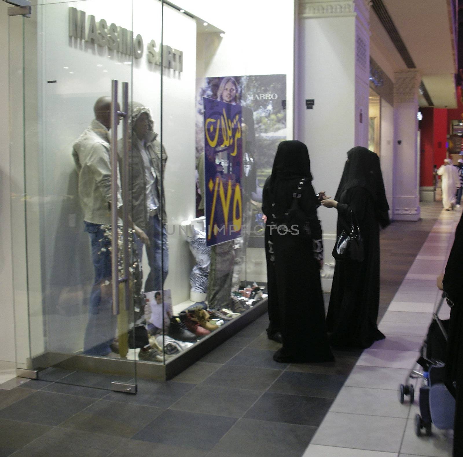 two veiled women shopping in a shopping mall in Dubai