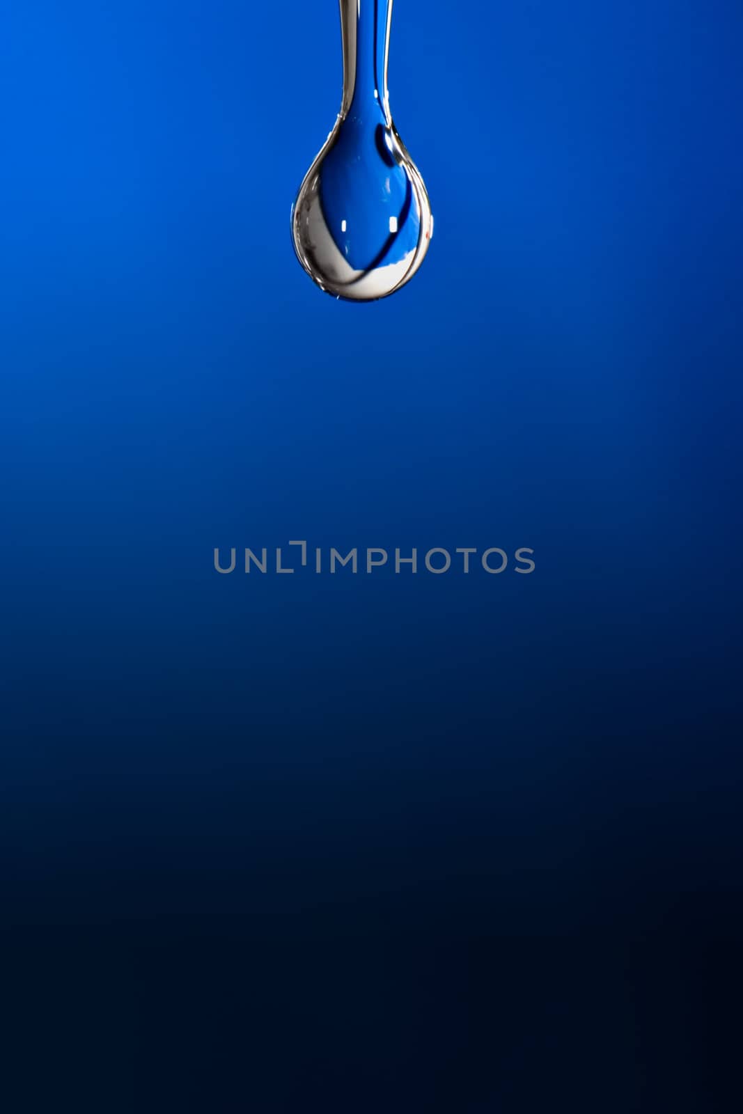 Water drop on blue background