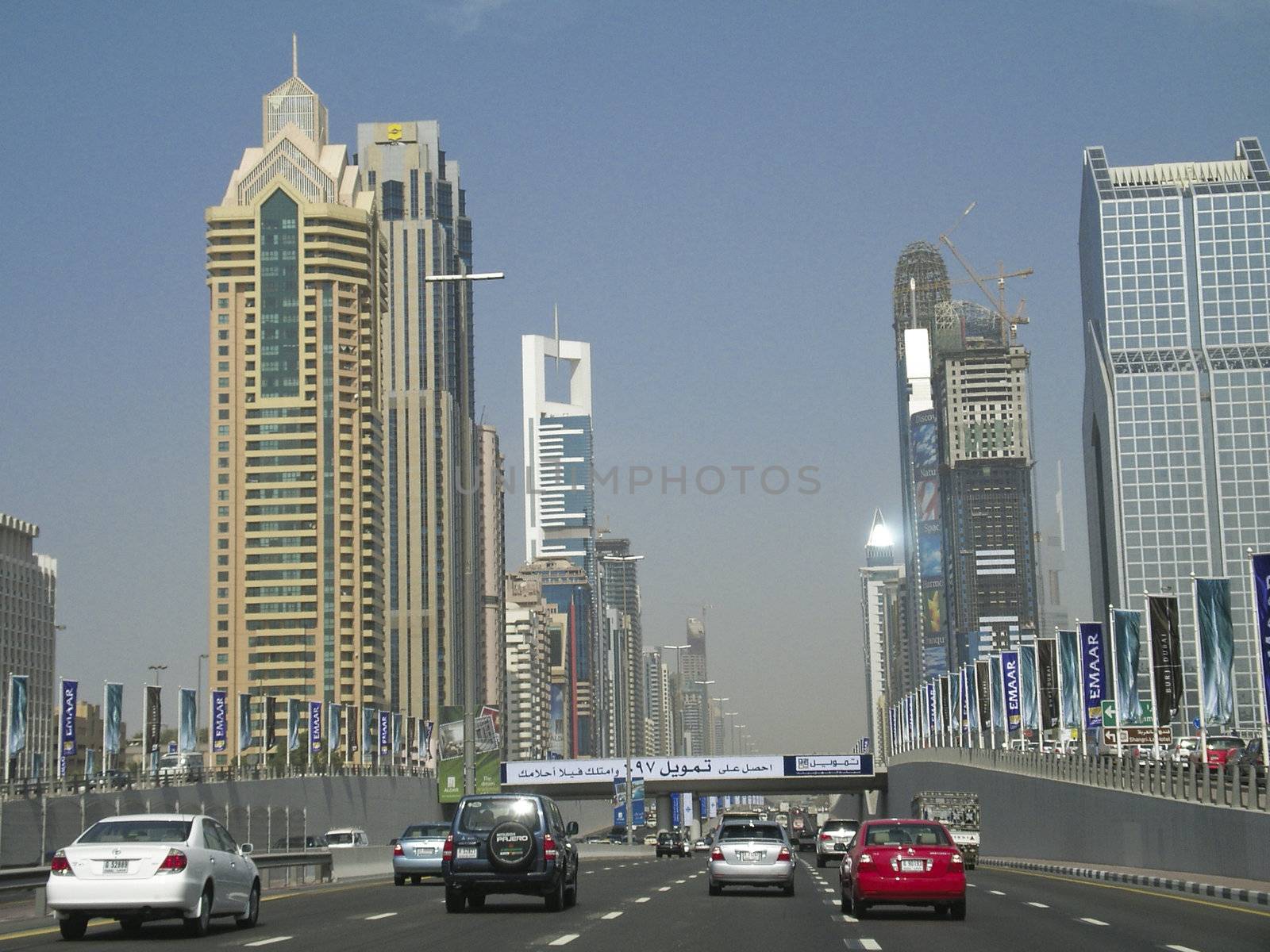 Busy road in Dubai surrounded by buildings