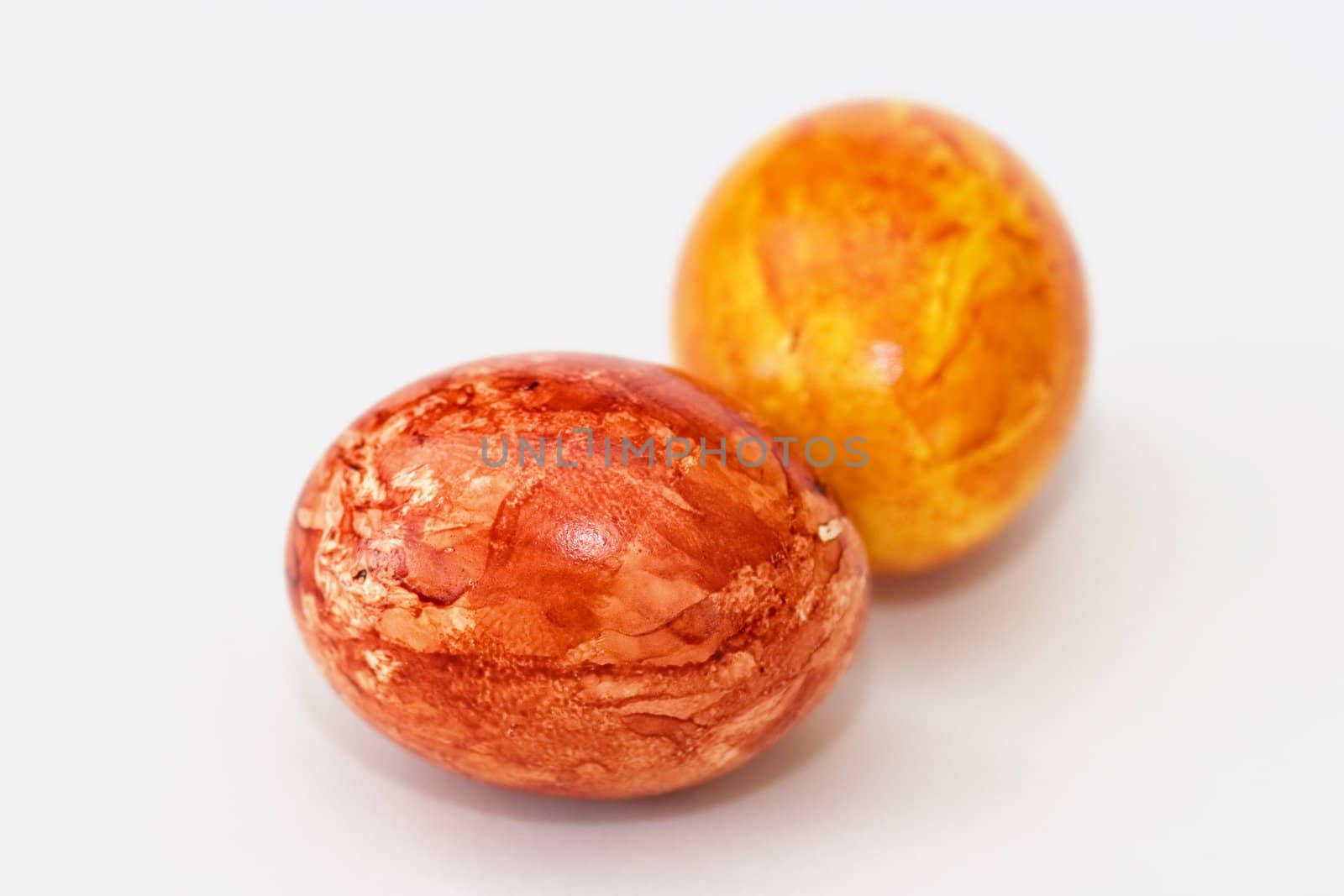 Colored eggs on white background