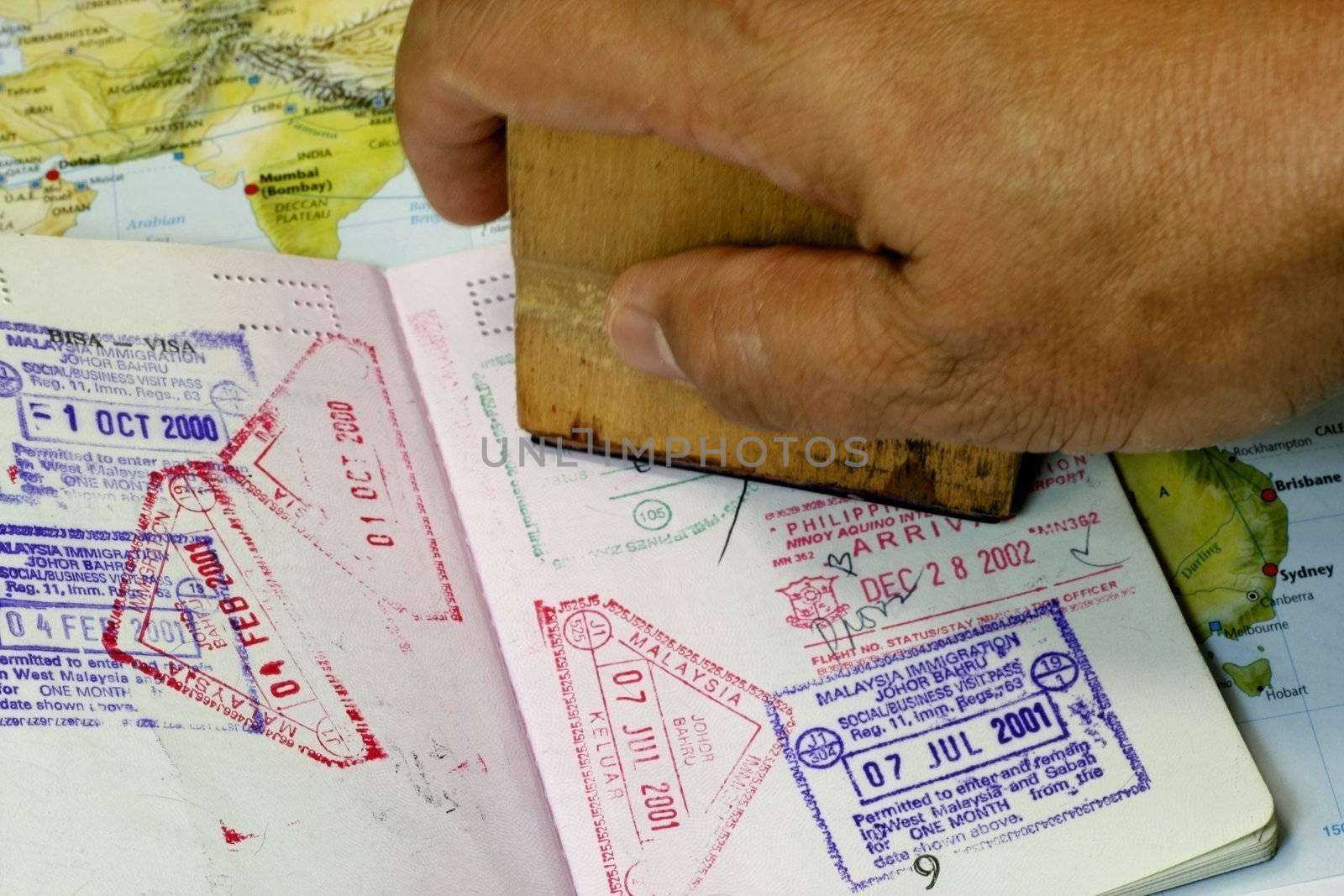 Immigration Stamp on Passport in a map background