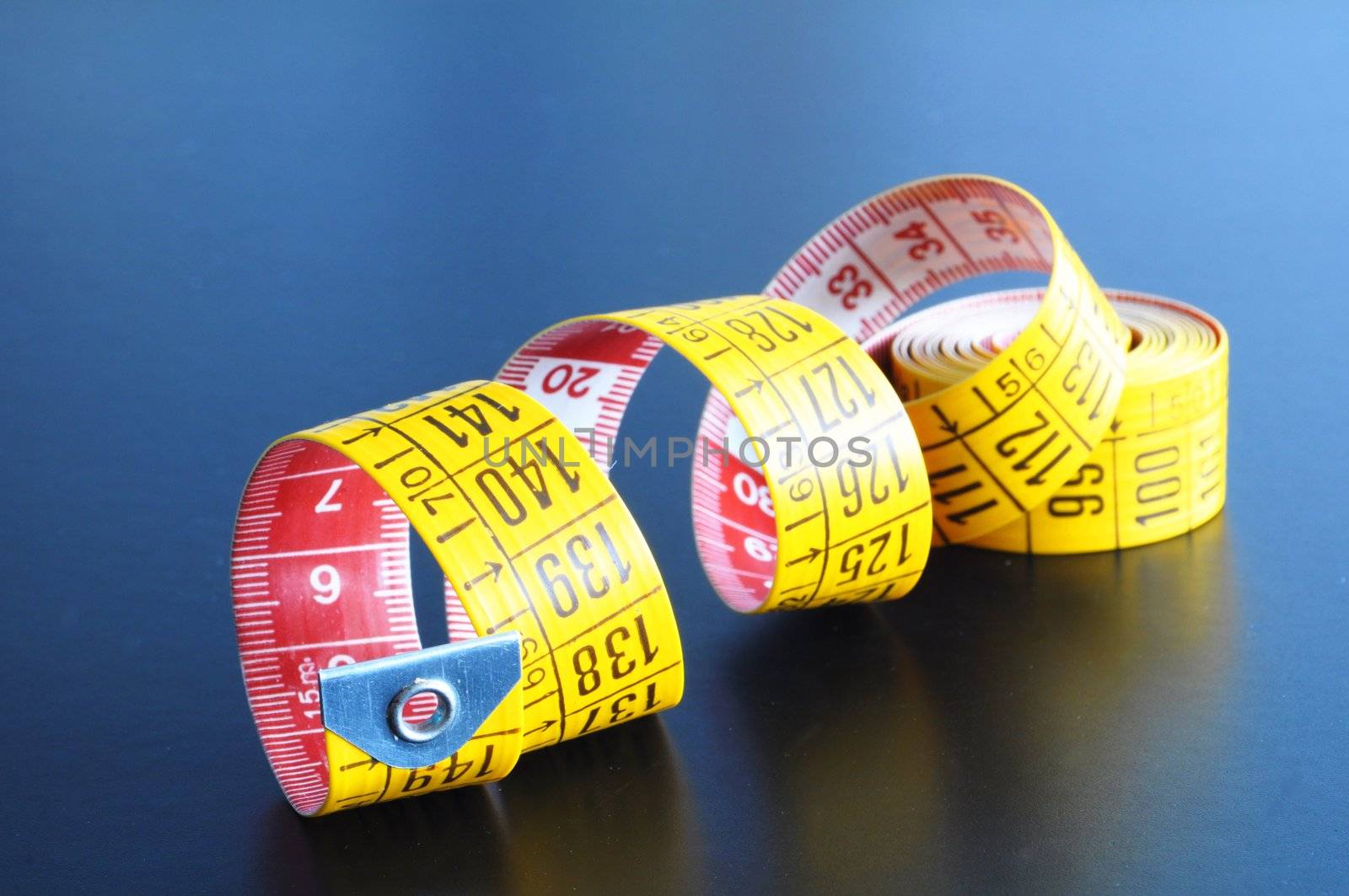 measuring tape of the tailor with copyspace for a text message