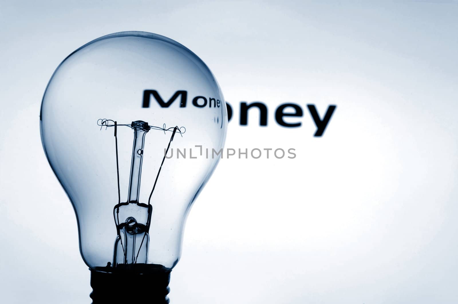 bulb and money text showing concept of financial success