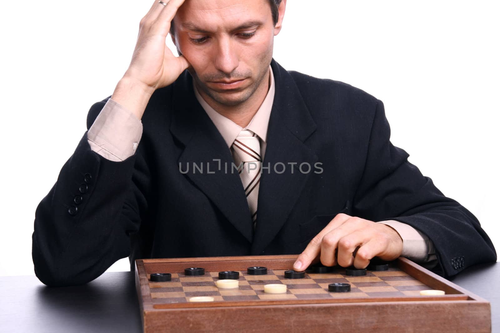 businessman playing chess over white background