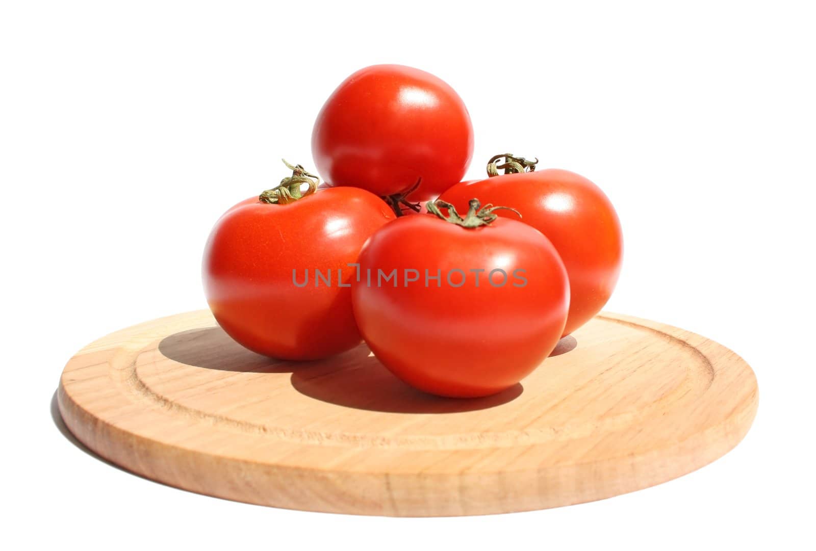 Ripe tomato on a white background.