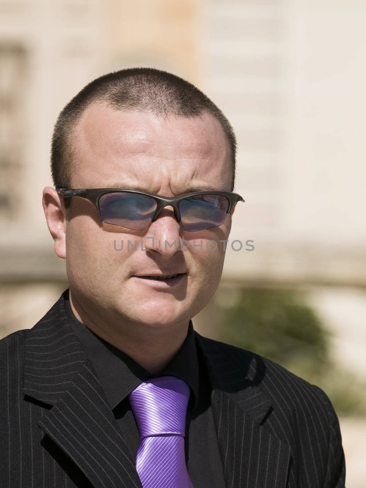 Portrait photo of a male criminal looking businessman      