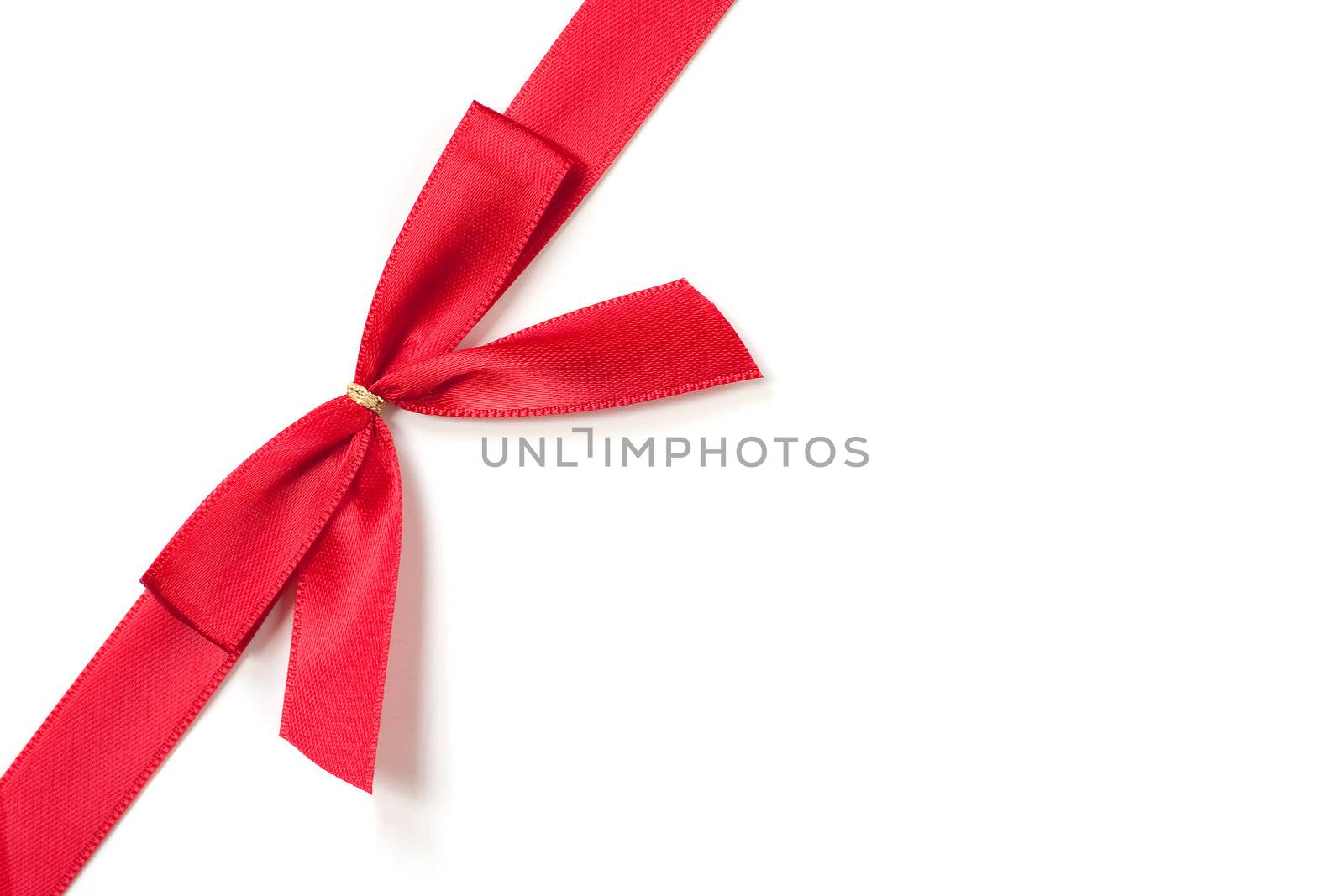 Red sild ribbon, tied in a bow on a white background.