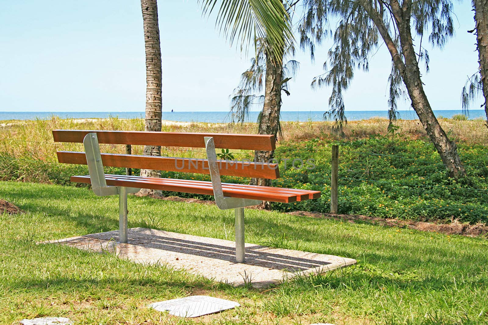 Empty Park Bench at Yorkeys Knob Beach by Joyce