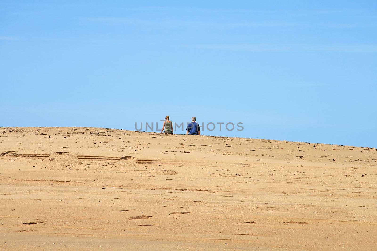 Couple Disappearing over Sandy Rise