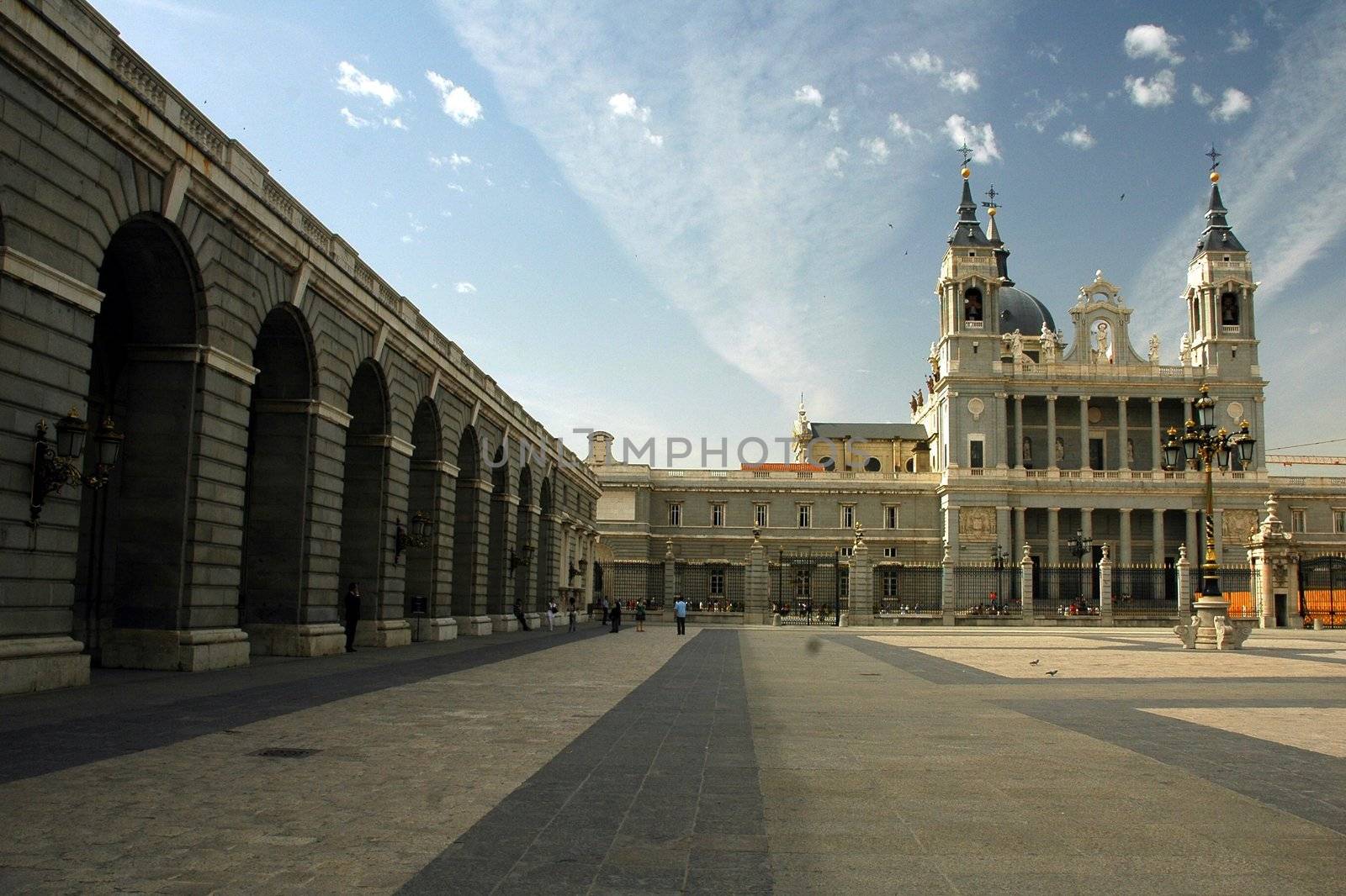 Madrid palace in sunny day with blue sky covered by cloud.