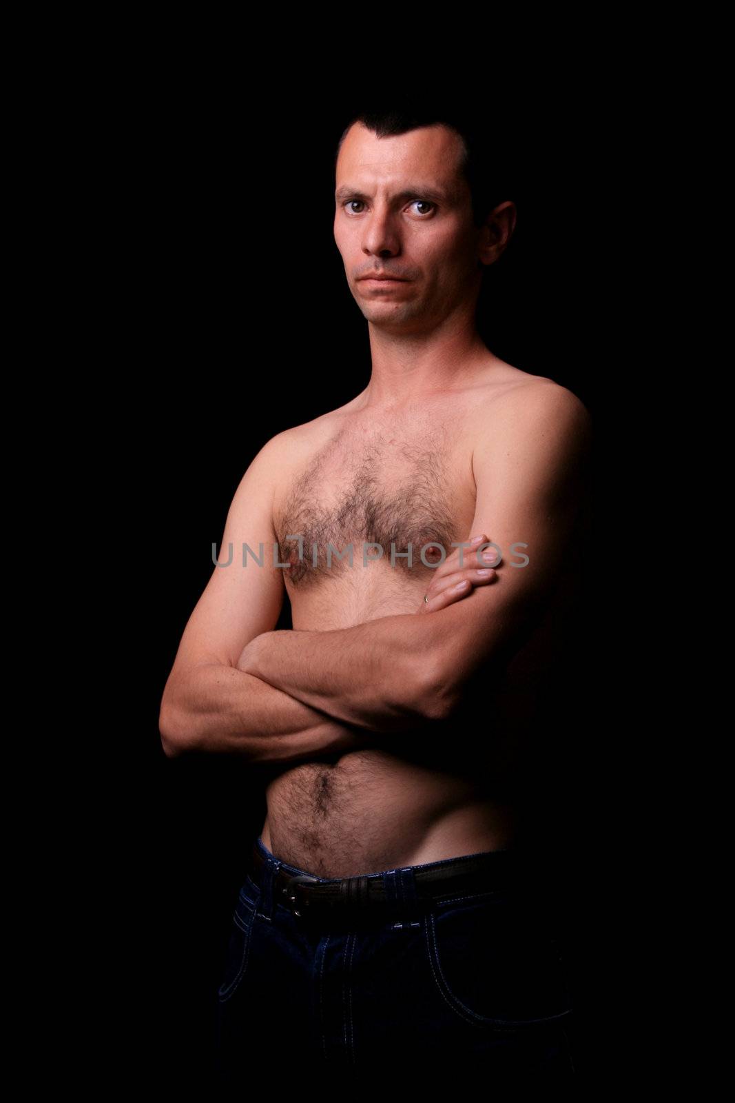 young man over black background