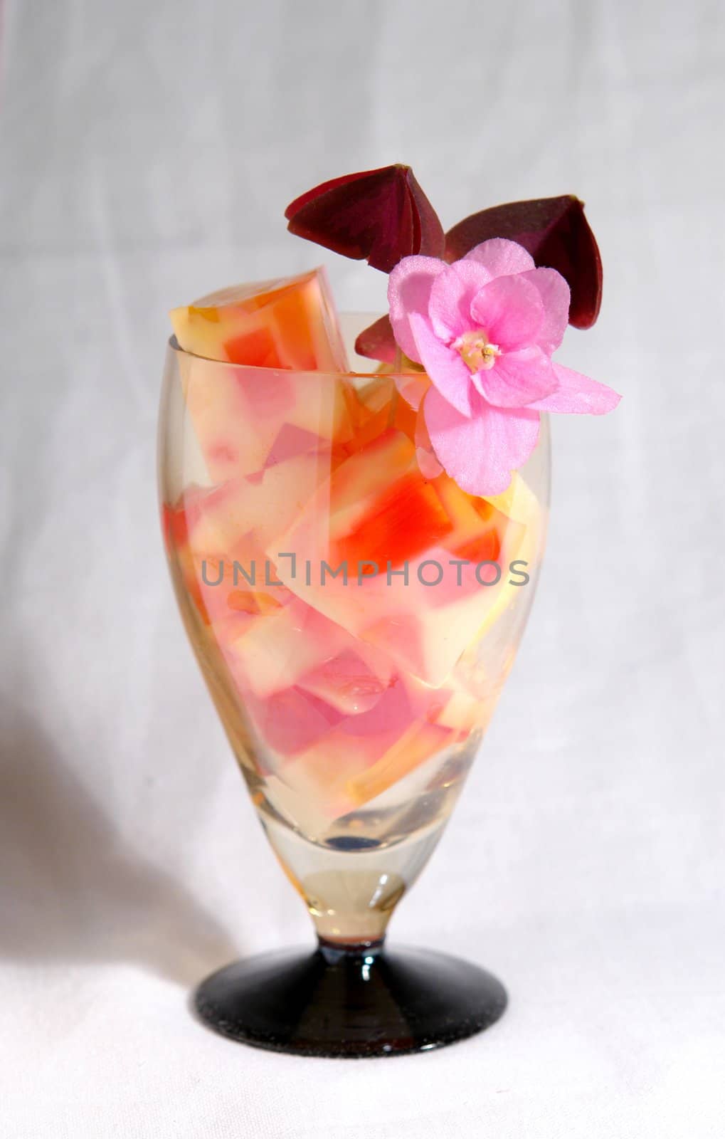                                A glass with colourfull jelly in it