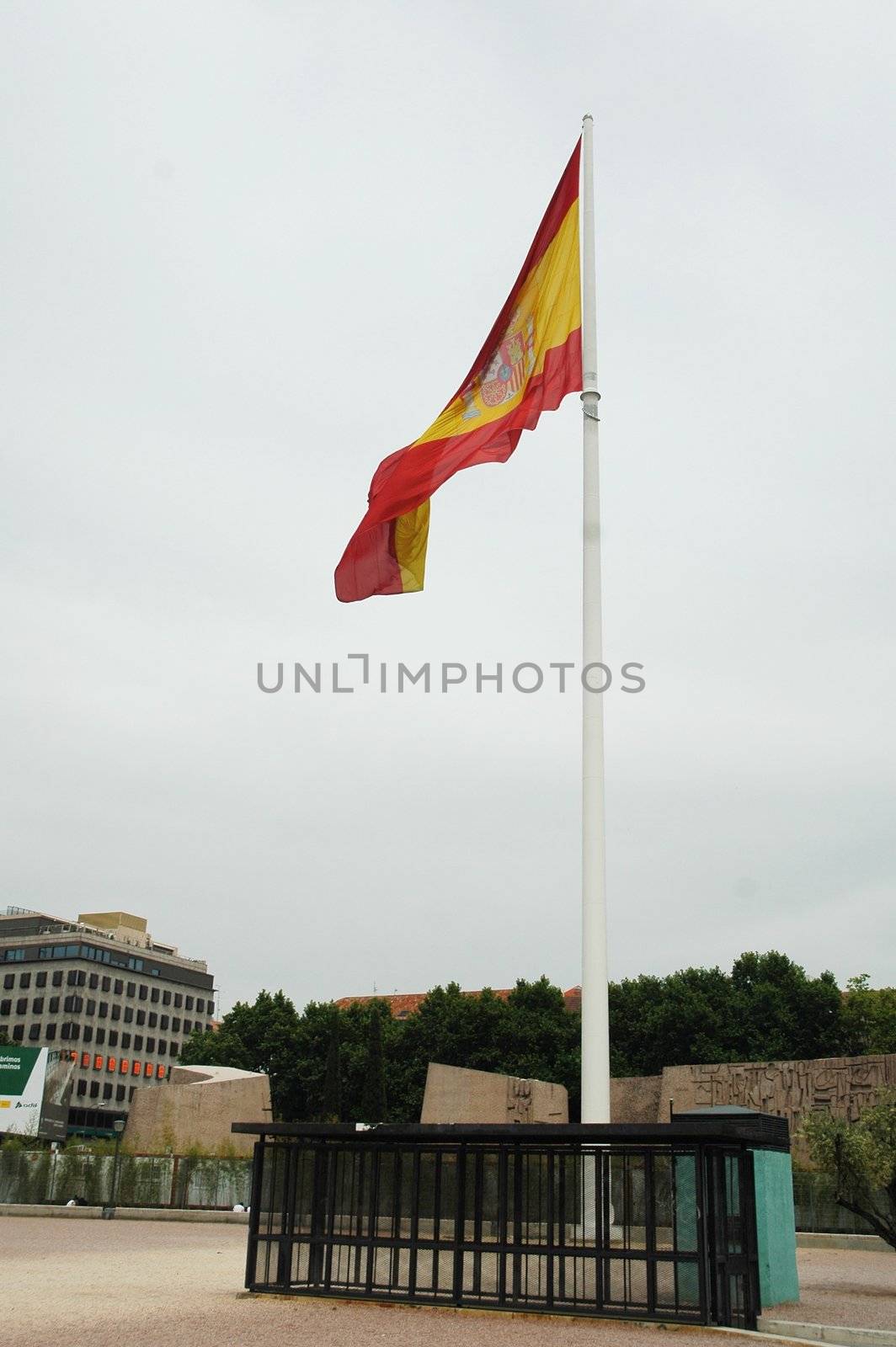 spanish flag in madrid with sky, vertically framed picture