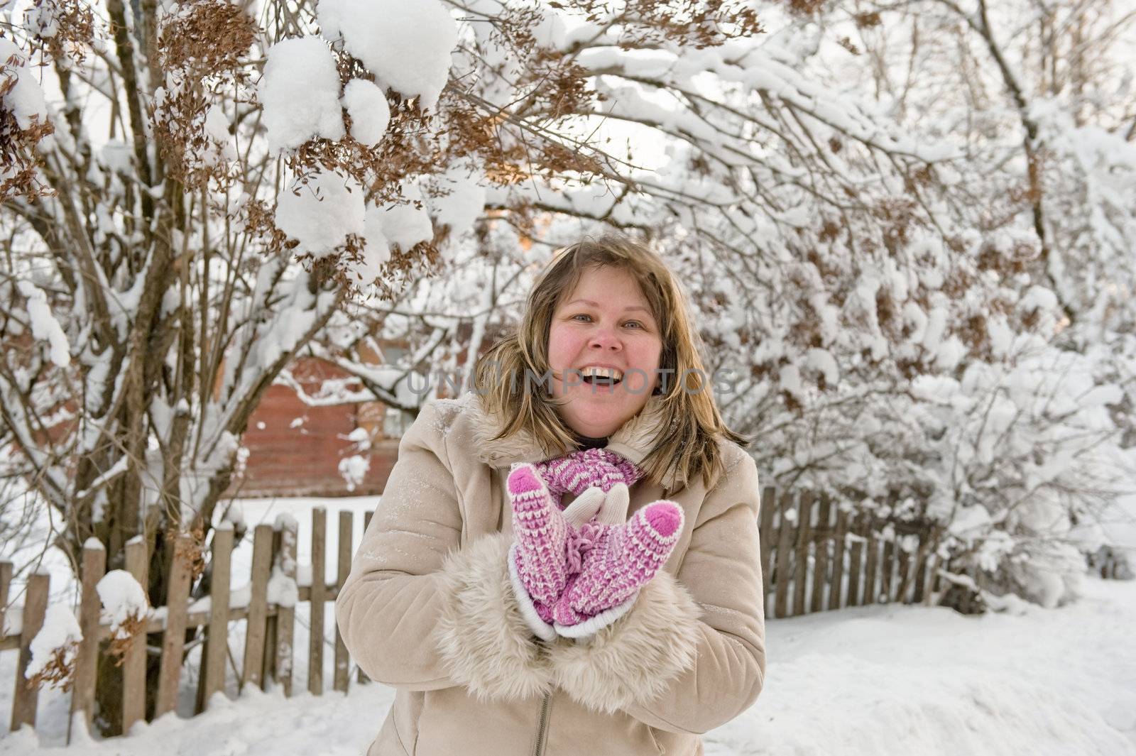 Happy middle-aged women having fun on winters day.