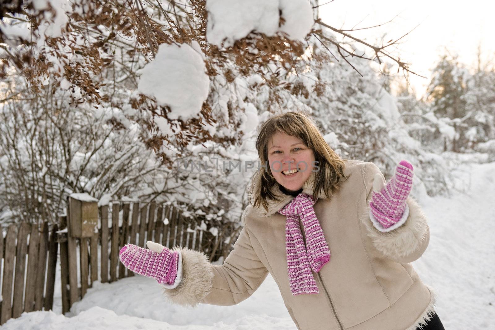 Happy middle-aged women having fun on winters day.