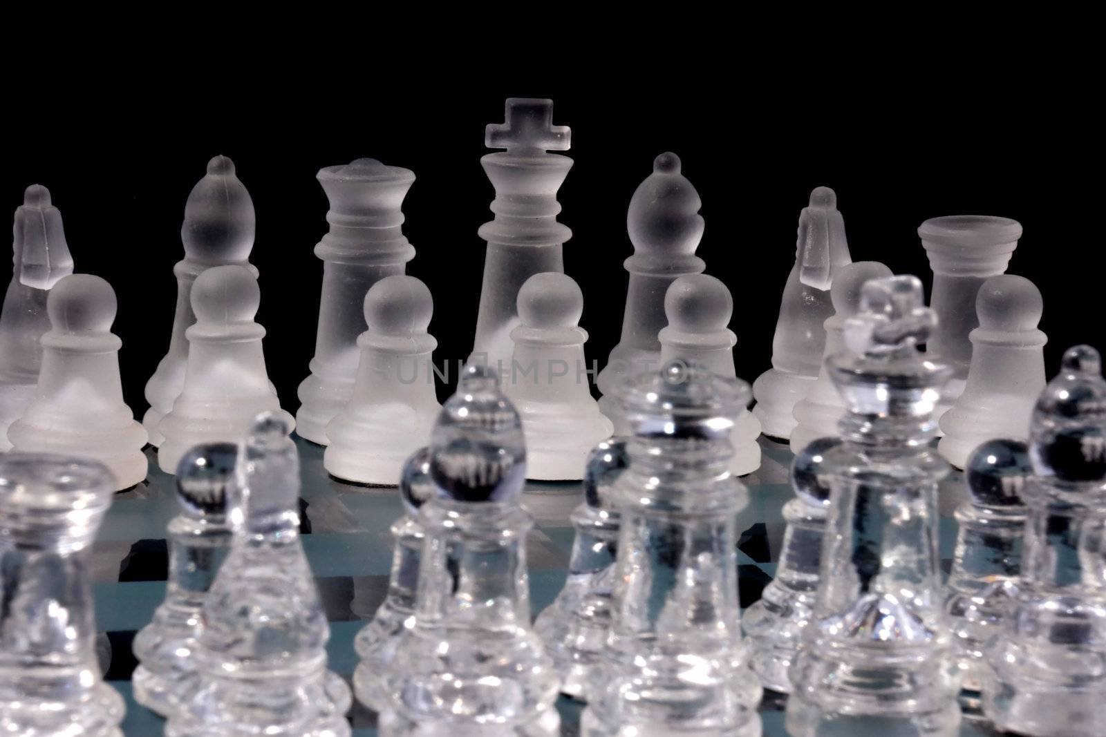 Chess Game - Chess Pieces on a glass chessboard